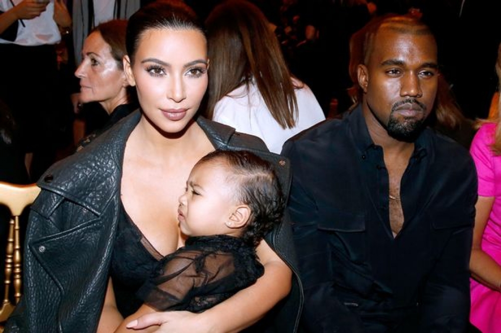 Kim Kardashian u Kanye West ma' binthom North